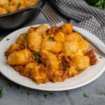 Slow cooker sloppy joe casserole on a white plate.