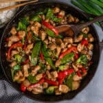 Teriyaki chicken stir fry in a cast iron skillet.