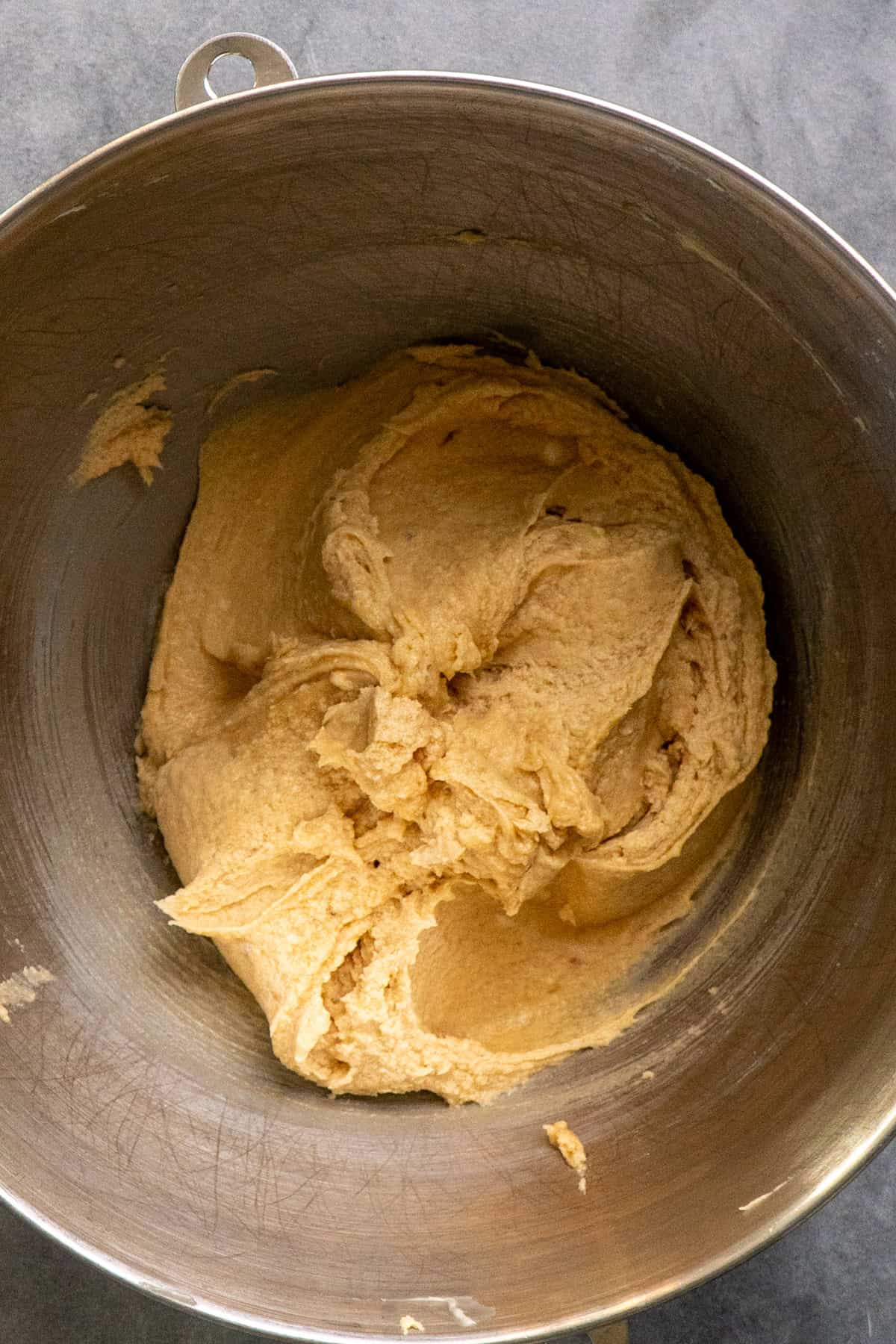 Wet ingredients mixed together in a metal mixing bowl.