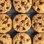 Oatmeal chocolate chip cookies on a wire cooling rack.