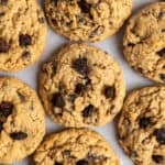 Oatmeal raisin cookies on parchment paper.