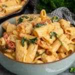 Marry me chicken pasta in a bowl with more in a skillet.