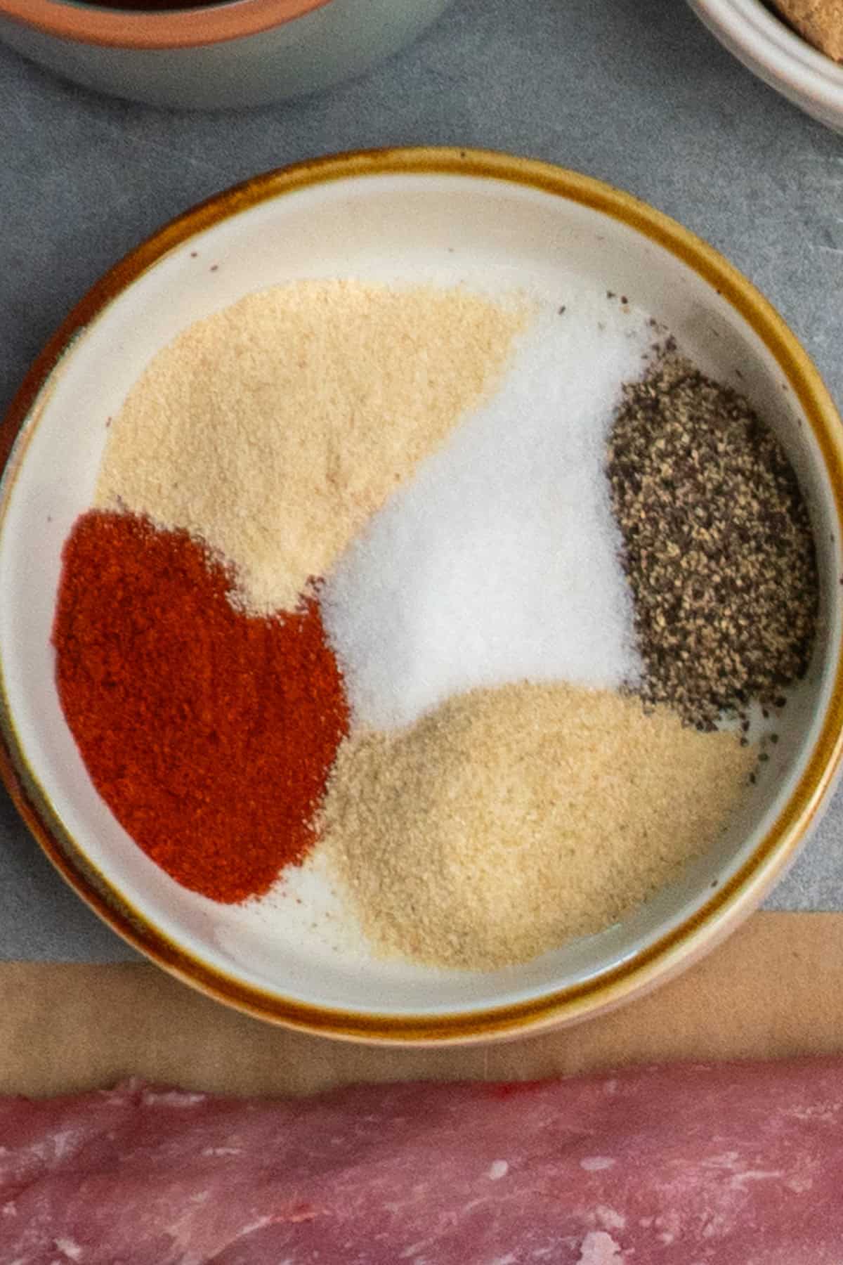 Dry rub seasonings ready to be mixed together in a bowl.