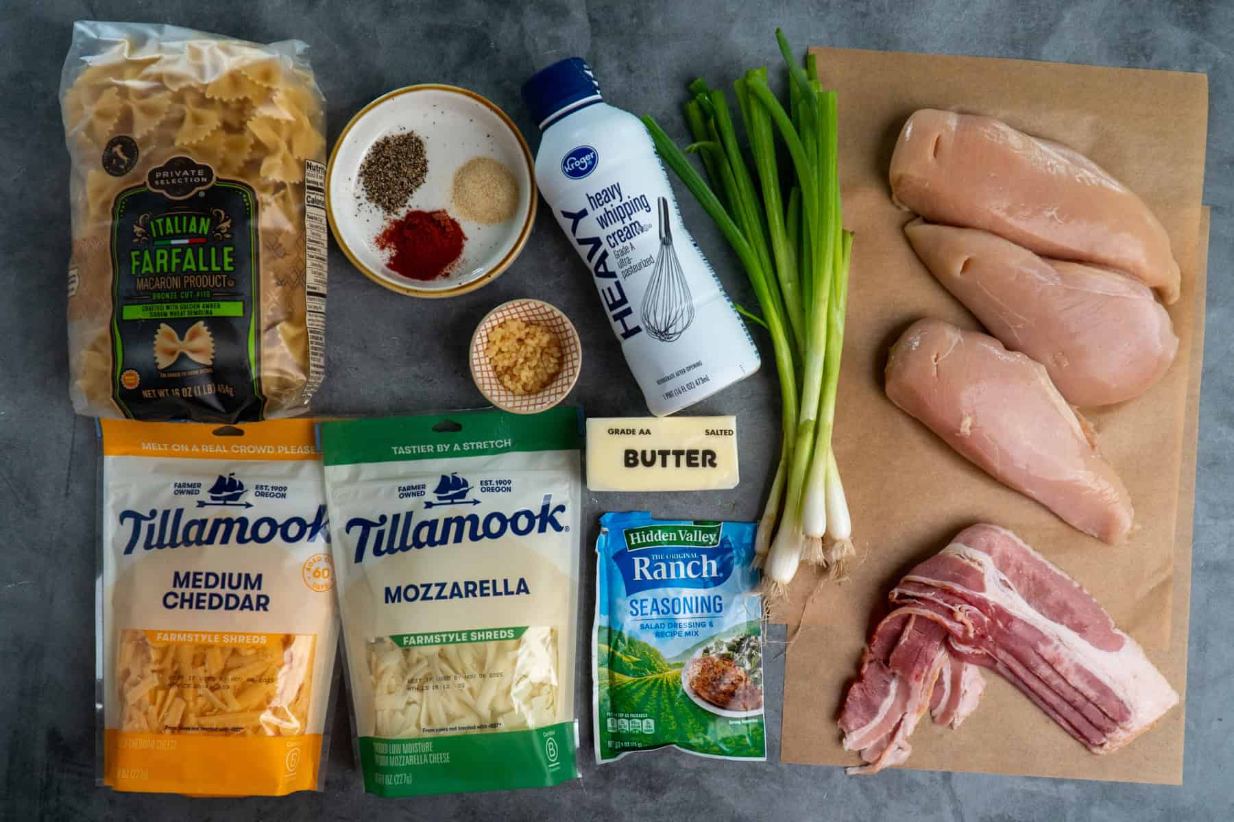 Ingredients to make crack chicken pasta on a gray countertop.