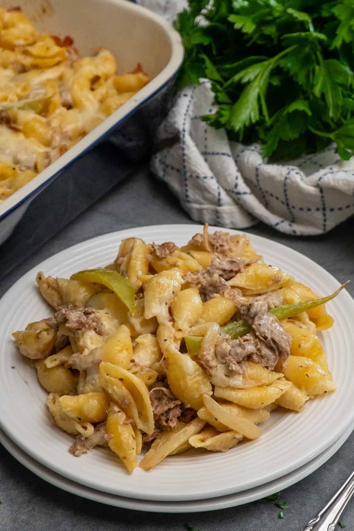 Philly cheesesteak casserole on a white plate.