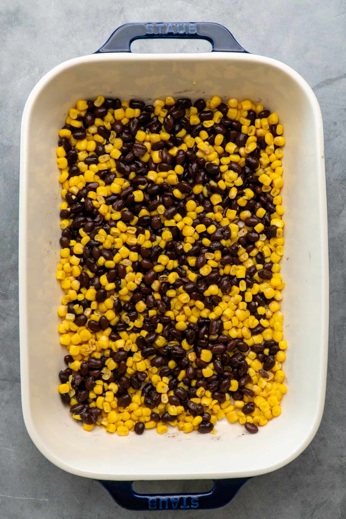 Corn and black beans in a baking dish.