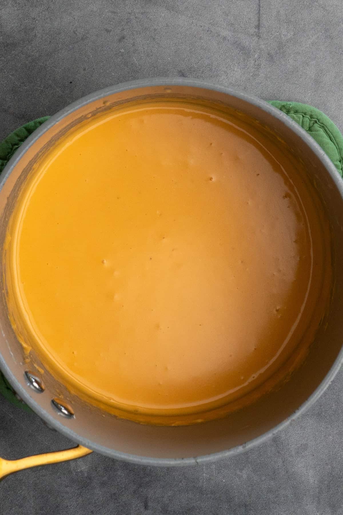Homemade cheese whiz in a sauce pan.