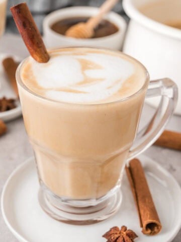 Chai latte recipe in a glass cup.