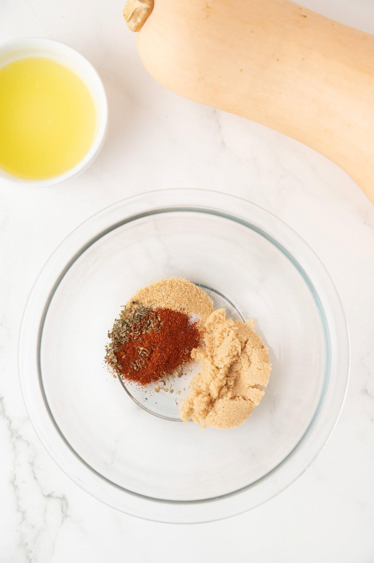 All the spices into a large bowl.