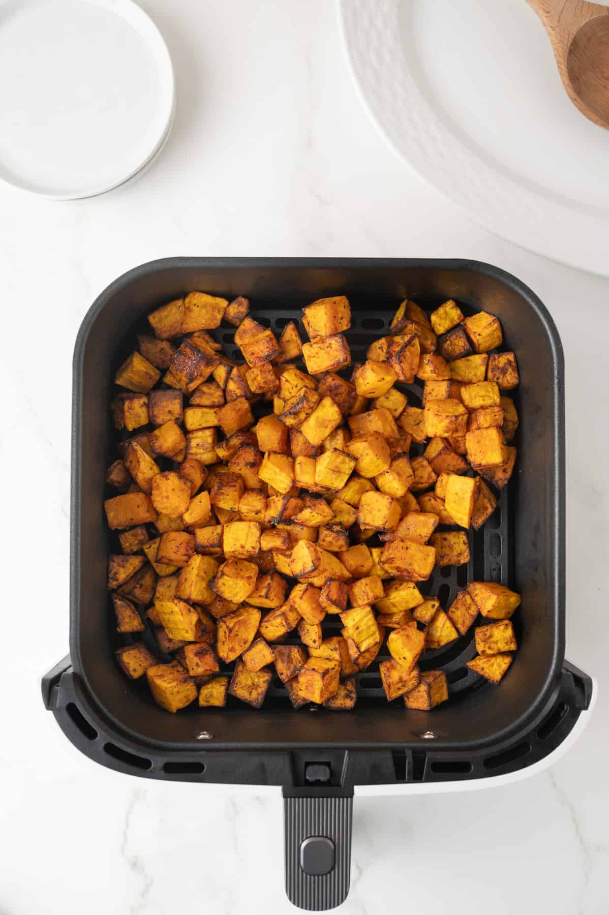 A second batch of squash in the air fryer.