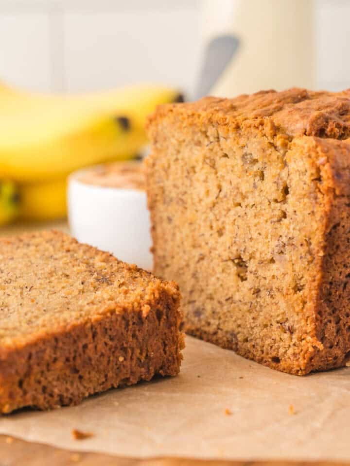 Peanut butter banana bread sliced open on a cutting board.