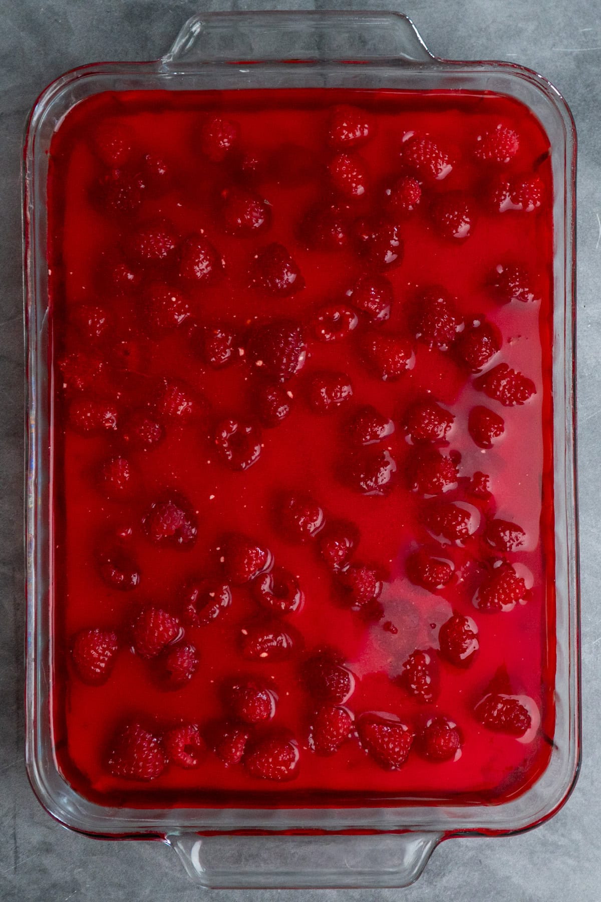 Raspberry added to the cream cheese layer with raspberry Jello poured over the top.