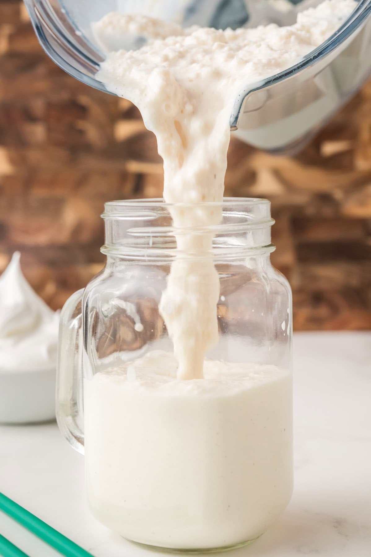 Frappuccino being poured into a glass.