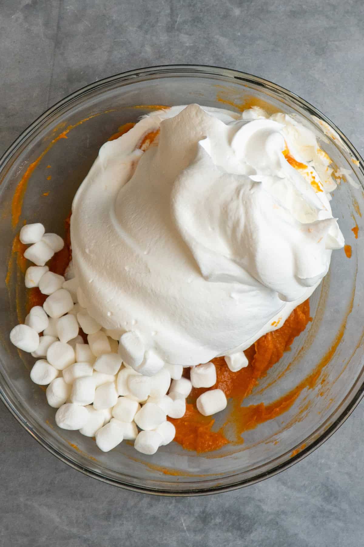 Marshmallows and whipped topping ready to be folded into pumpkin mixture.