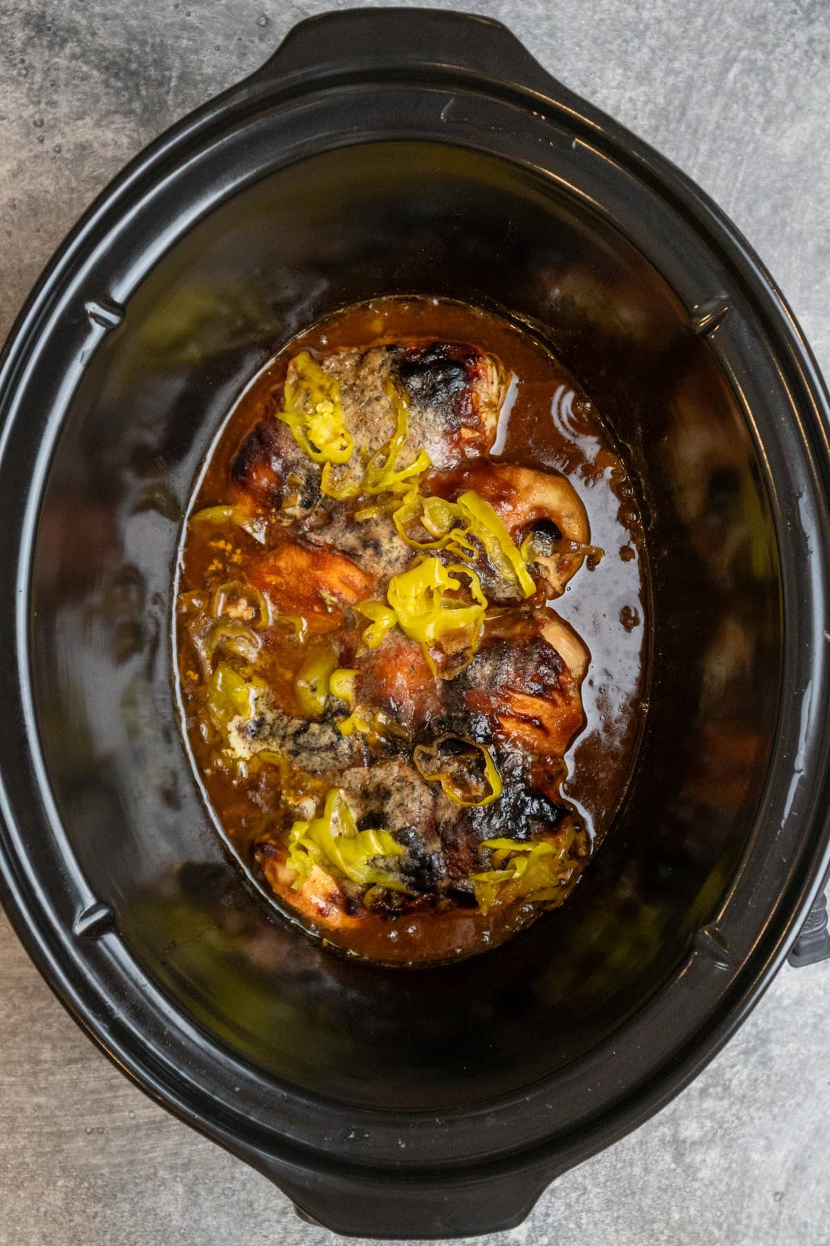 Mississippi chicken that has been cooked in a Crock Pot.