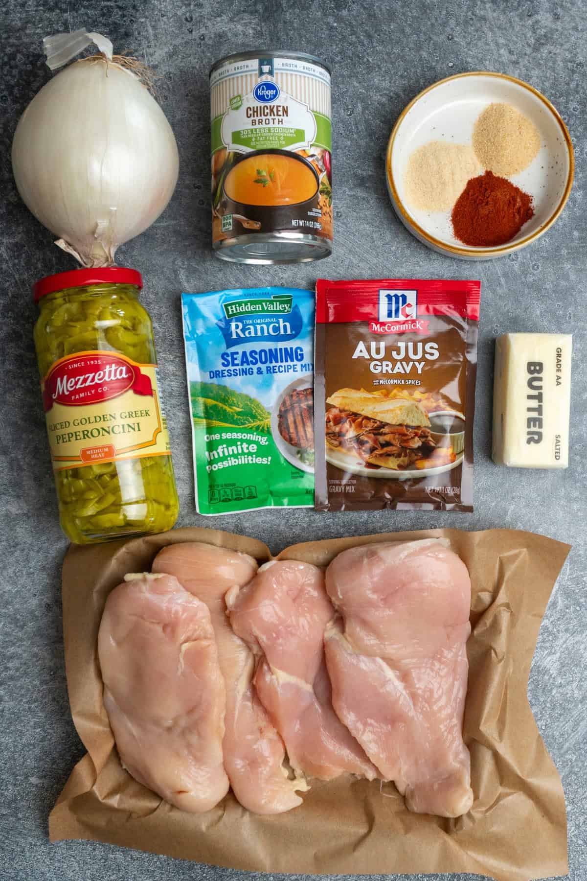 Ingredients to make Mississippi chicken on a gray countertop. 