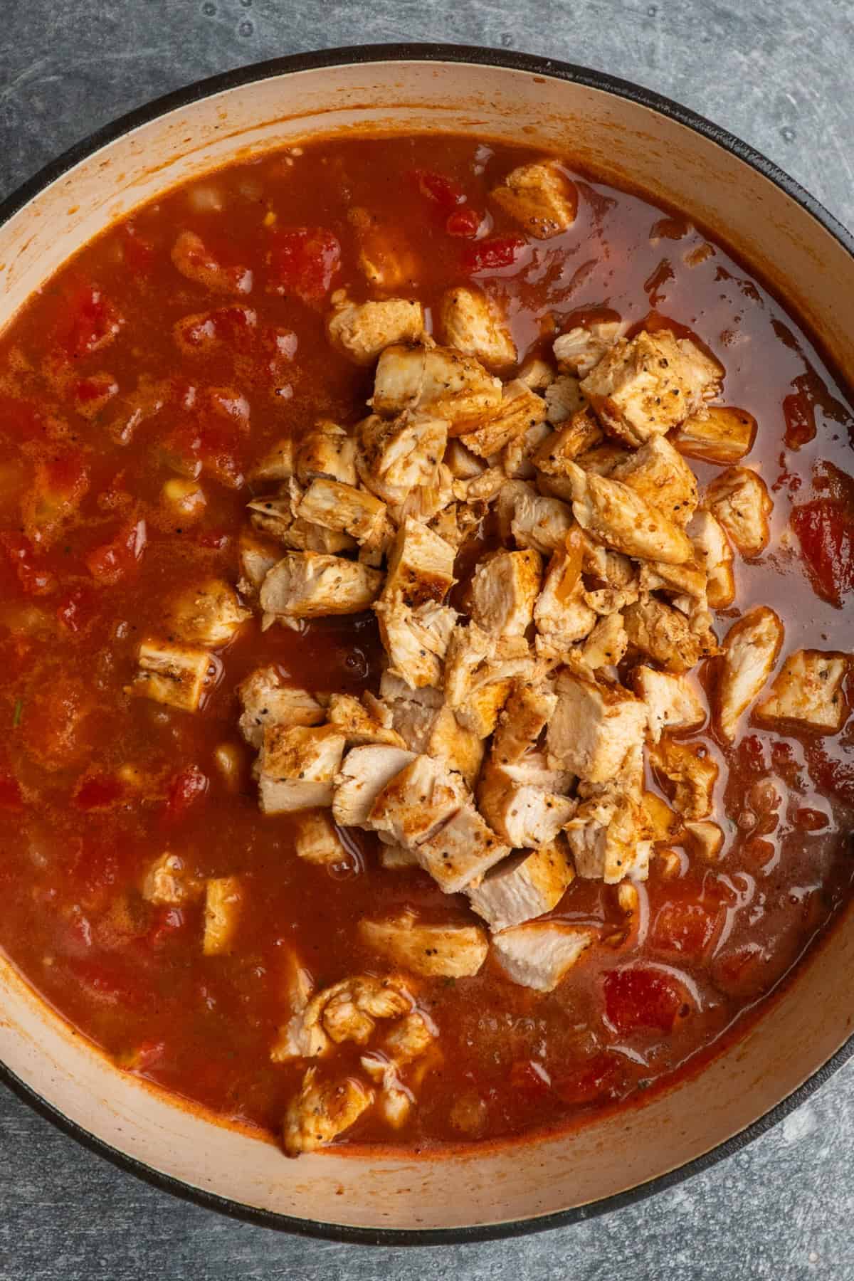 Cooked and chopped chicken added to the soup.