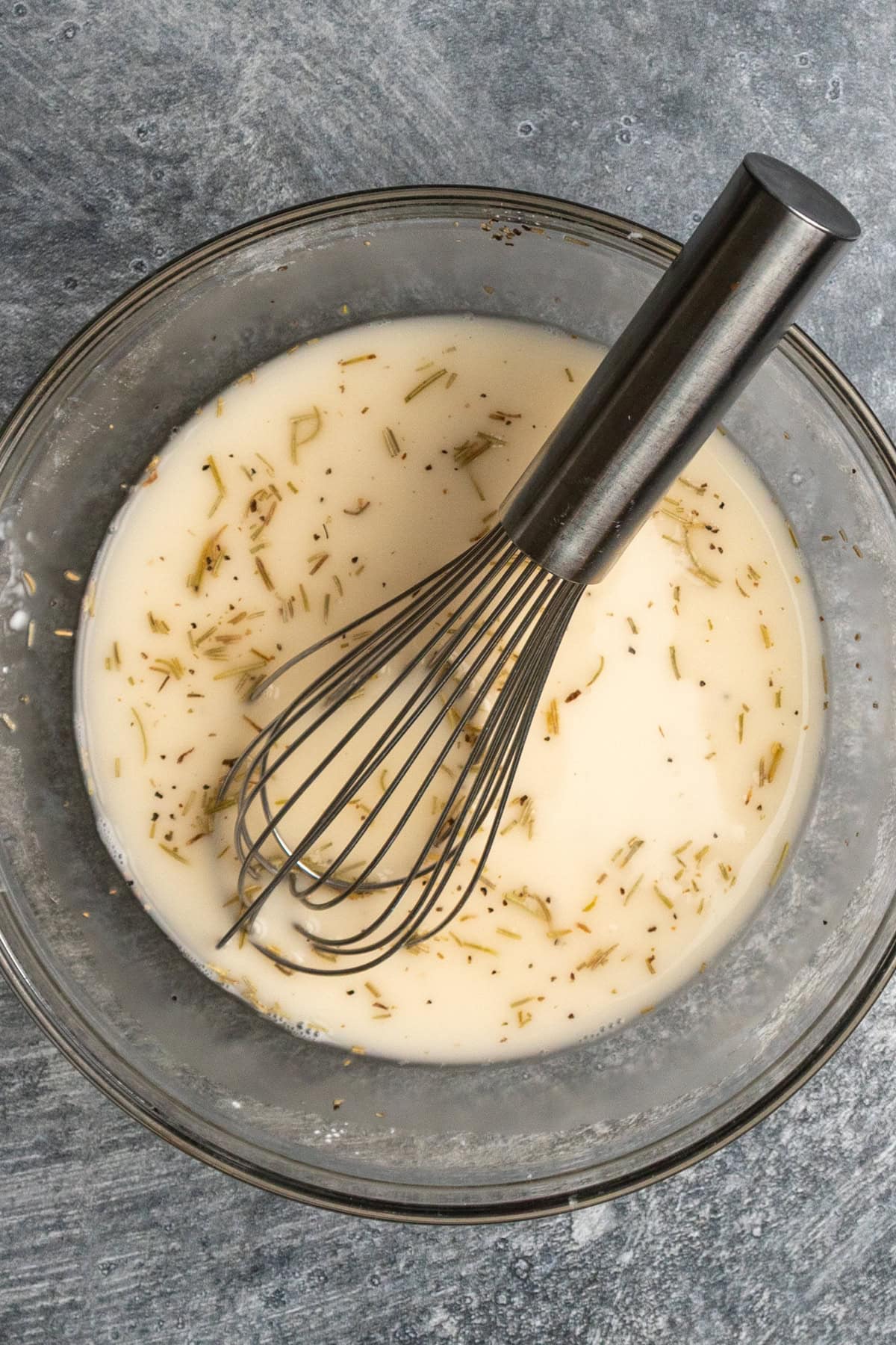 Sauce ingredients mixed together in a clear bowl.
