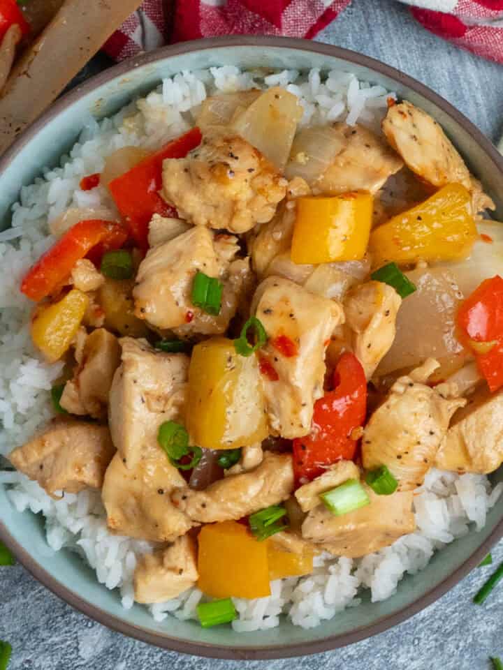 Sheet pan Hawaiian chicken over a bowl of rice.