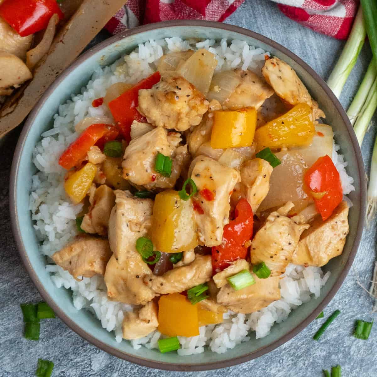 Sheet pan Hawaiian chicken over a bowl of rice.