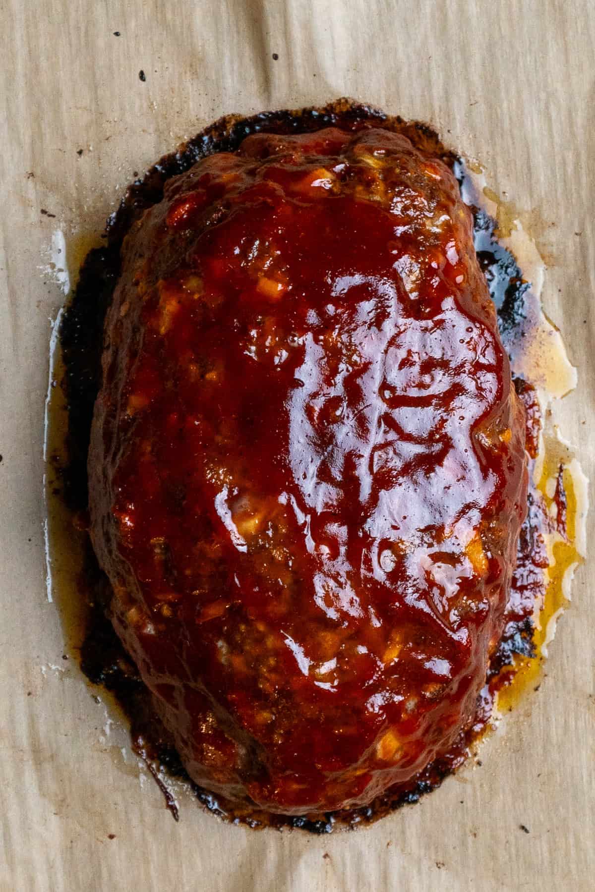 Meatloaf with glaze on it ready to finish being baked.