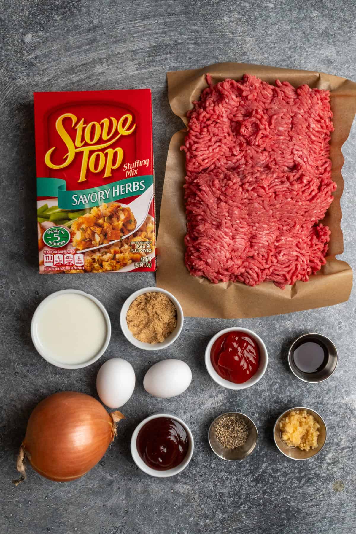 Ingredients to make Stove Top stuffing meatloaf on a gray countertop. 