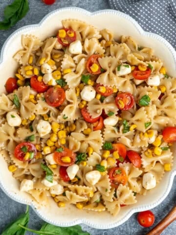 Caprese pasta salad in a white bowl ready to be served.