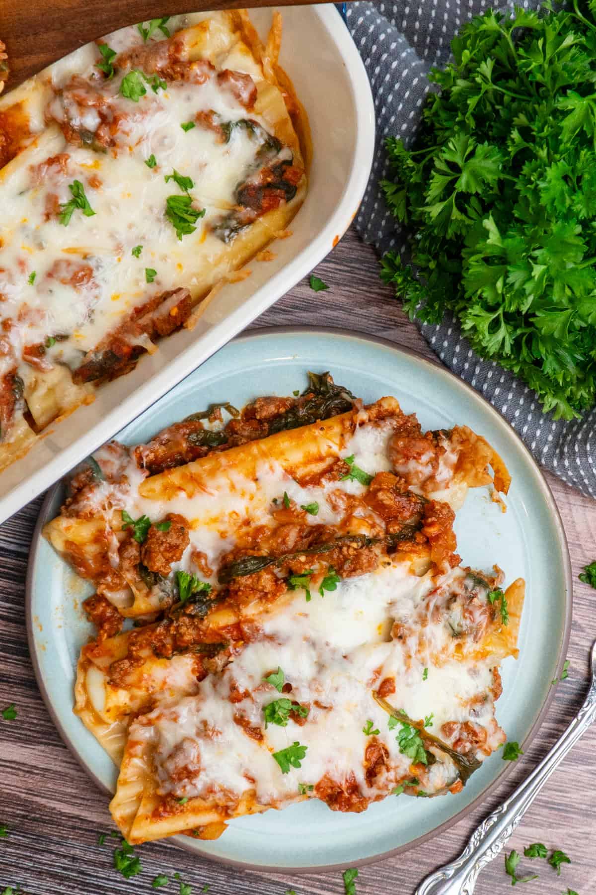 Three string cheese manicotti on a plate.