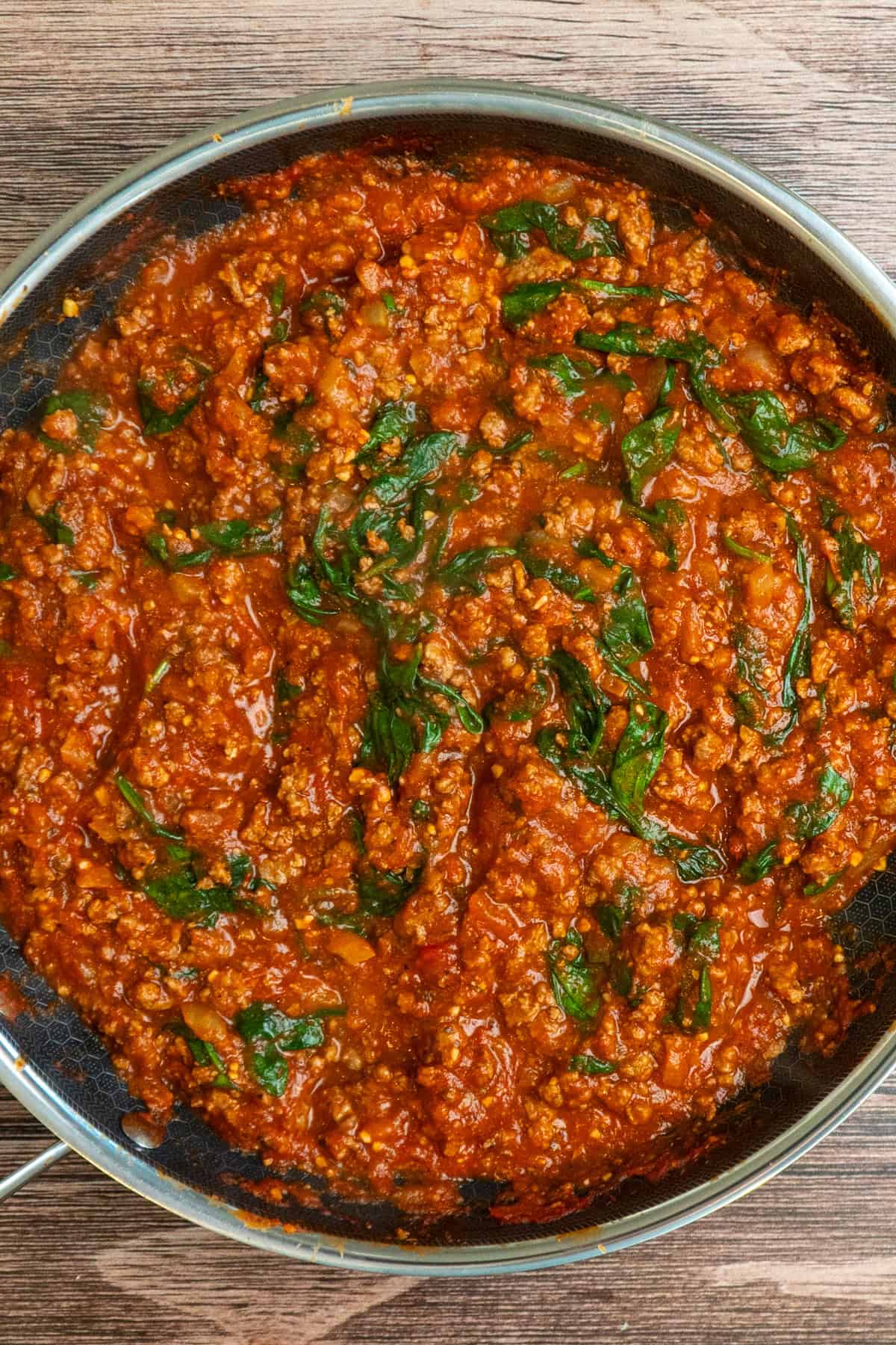 Ground beef, vegetables, seasonings and pasta sauce cooked together in a skillet.