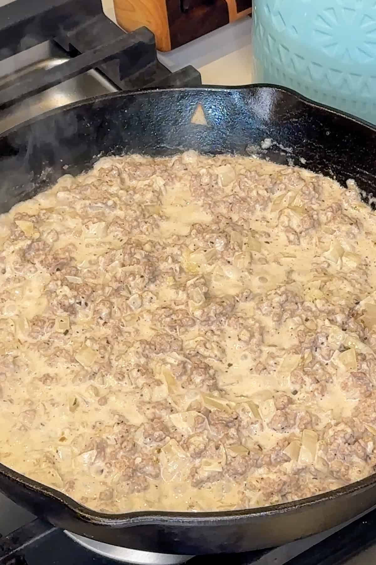 Heavy cream and parmesan cheese added to the beef and onions.