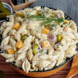 Dill pickle pasta salad in a colorful bowl ready to be served.